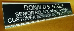 Black background, White lettering, Silver holder
