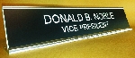 Black background, White lettering, Silver holder