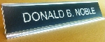 Black background, White lettering, Silver holder